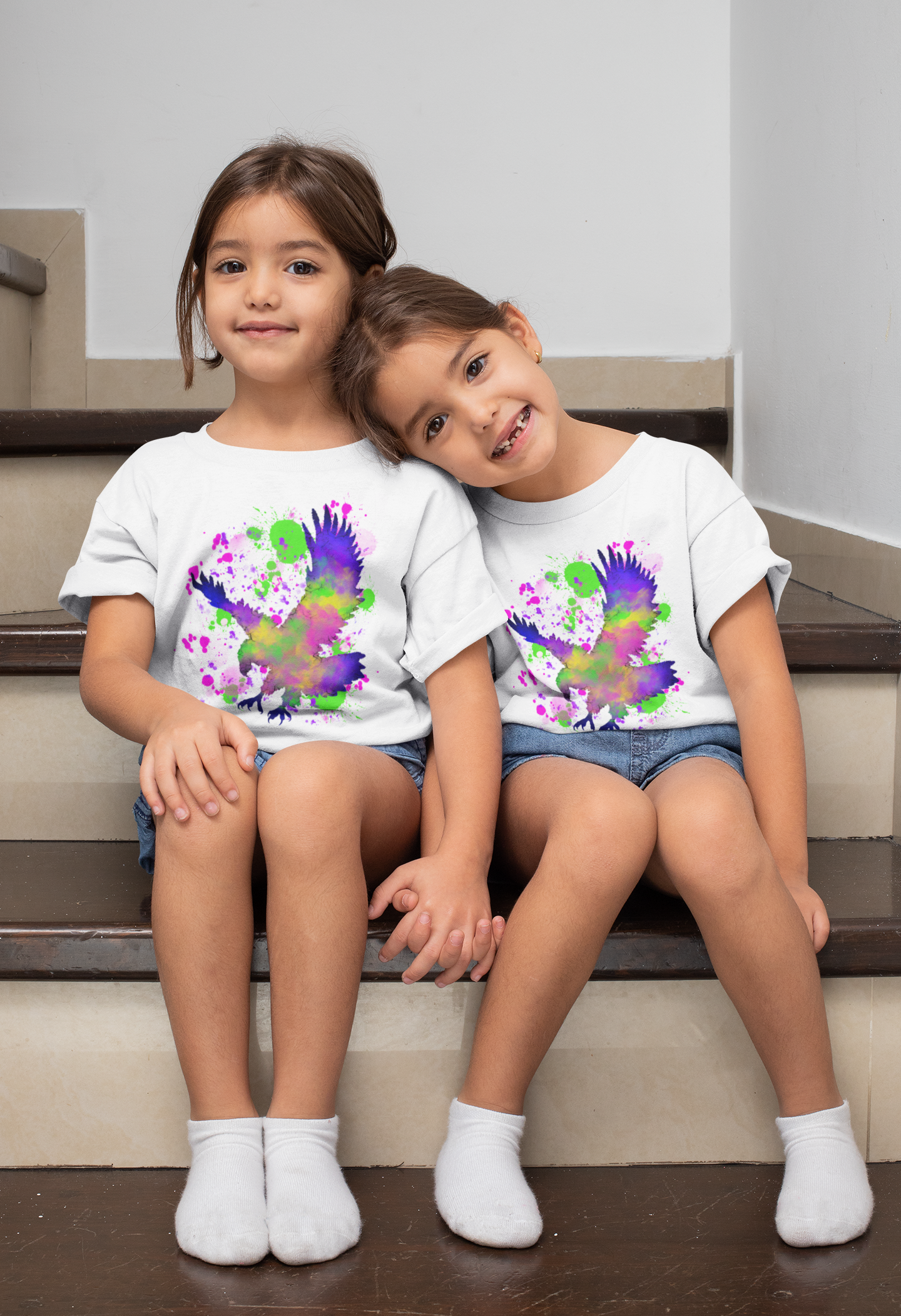 t-shirt-mockup-of-twin-girls-sitting-on-the-stairs-31020